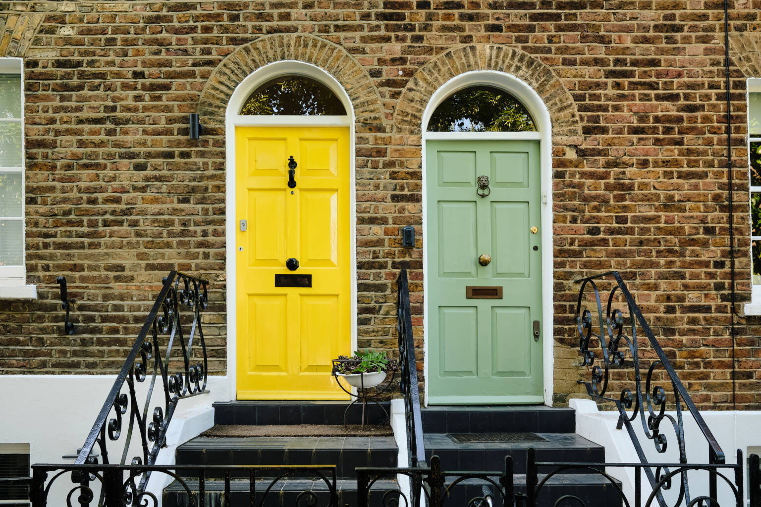 Front doors in a brick terrace